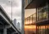 Class Conflict vs Class War in Canada Class War: Split image showing a luxury high-rise balcony on one side and a tent encampment under a highway overpass on the other, Canadian city skyline visible in both halves.